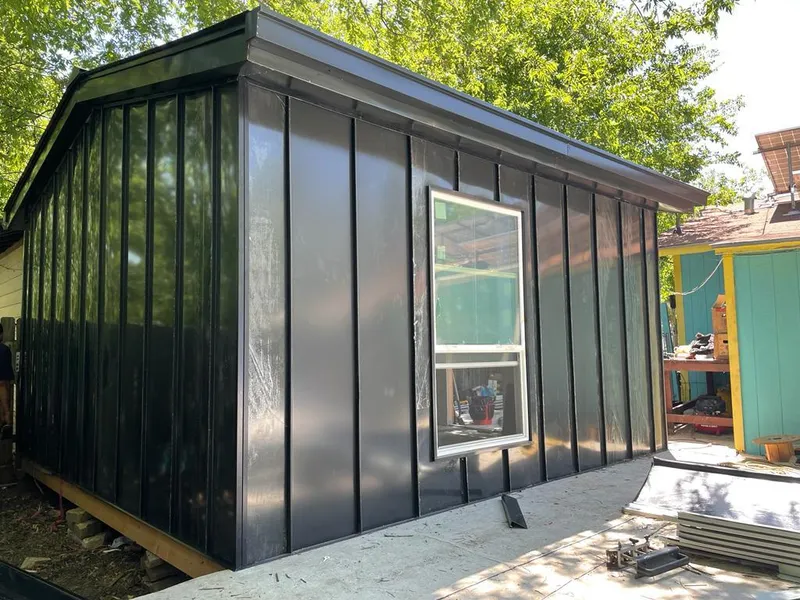 Black standing seam metal wall panels for Roof Inspection in Santa Fe